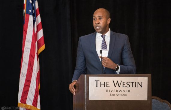an event photo of a man giving a speech at the Westin in San Antonio