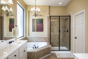 a photo of a nice master bathroom with tub and shower