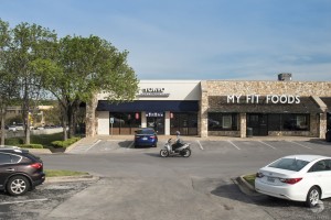 an elevated exterior photo of West Woods Shopping Center in Austin, TX