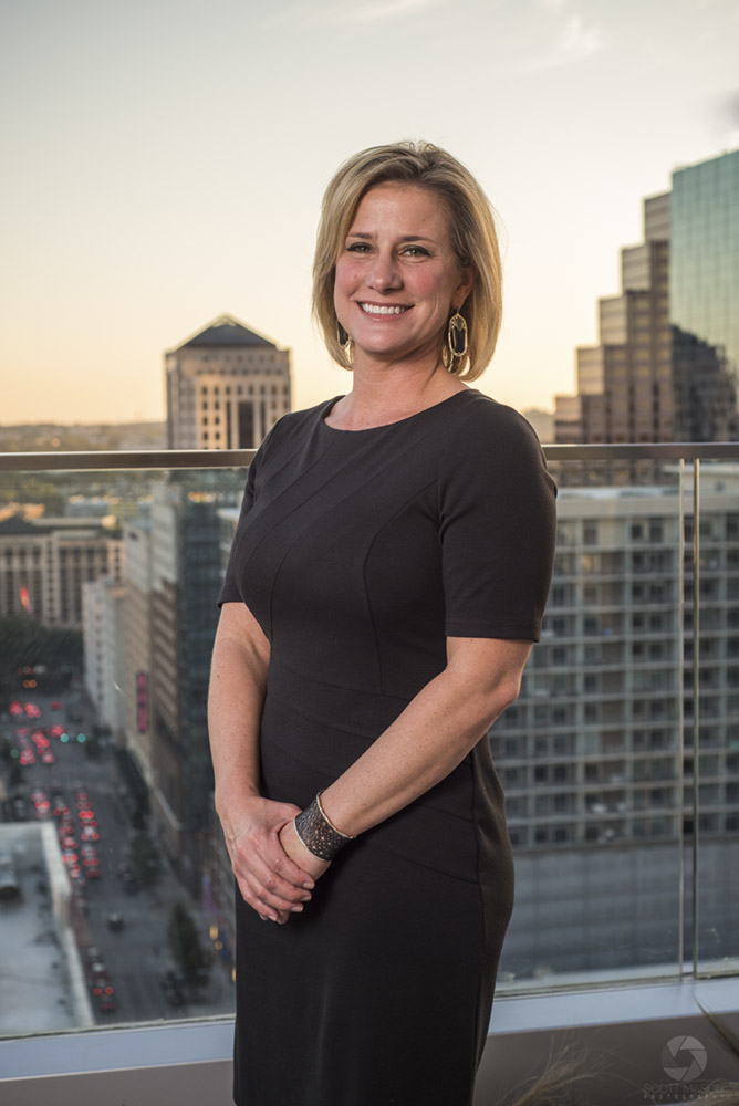 a business portrait of a woman on the roof of the Westin hotel in Austin