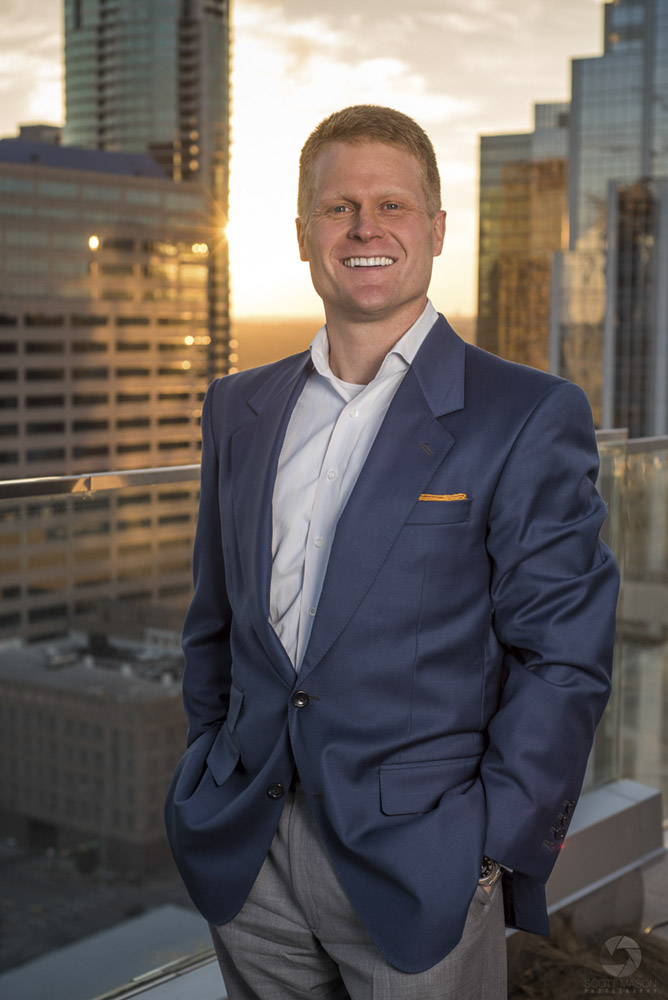 a business portrait of a man on the roof of the Westin hotel in Austin