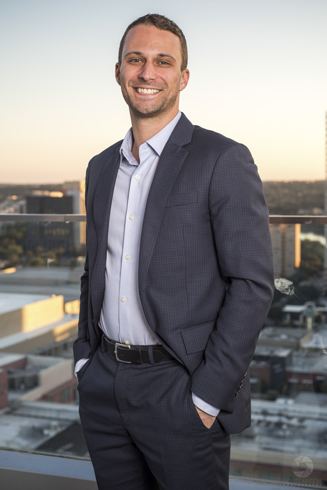 a business portrait of a man on the roof of the Westin hotel in Austin