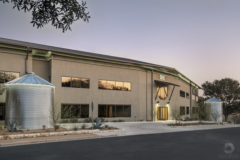 a twilight exterior photo of an office building