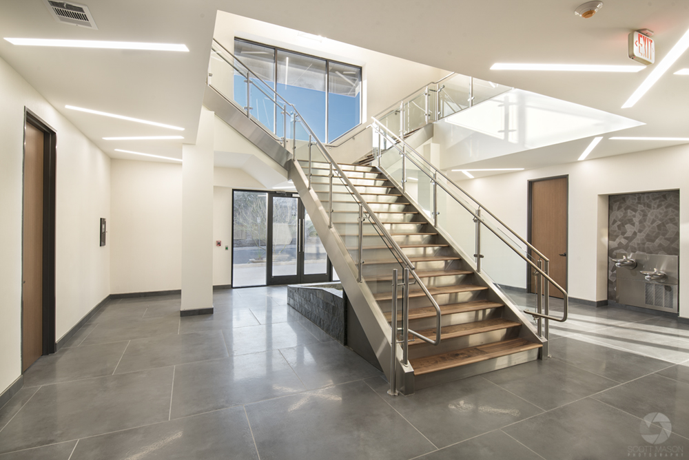 the grand staircase of an office lobby