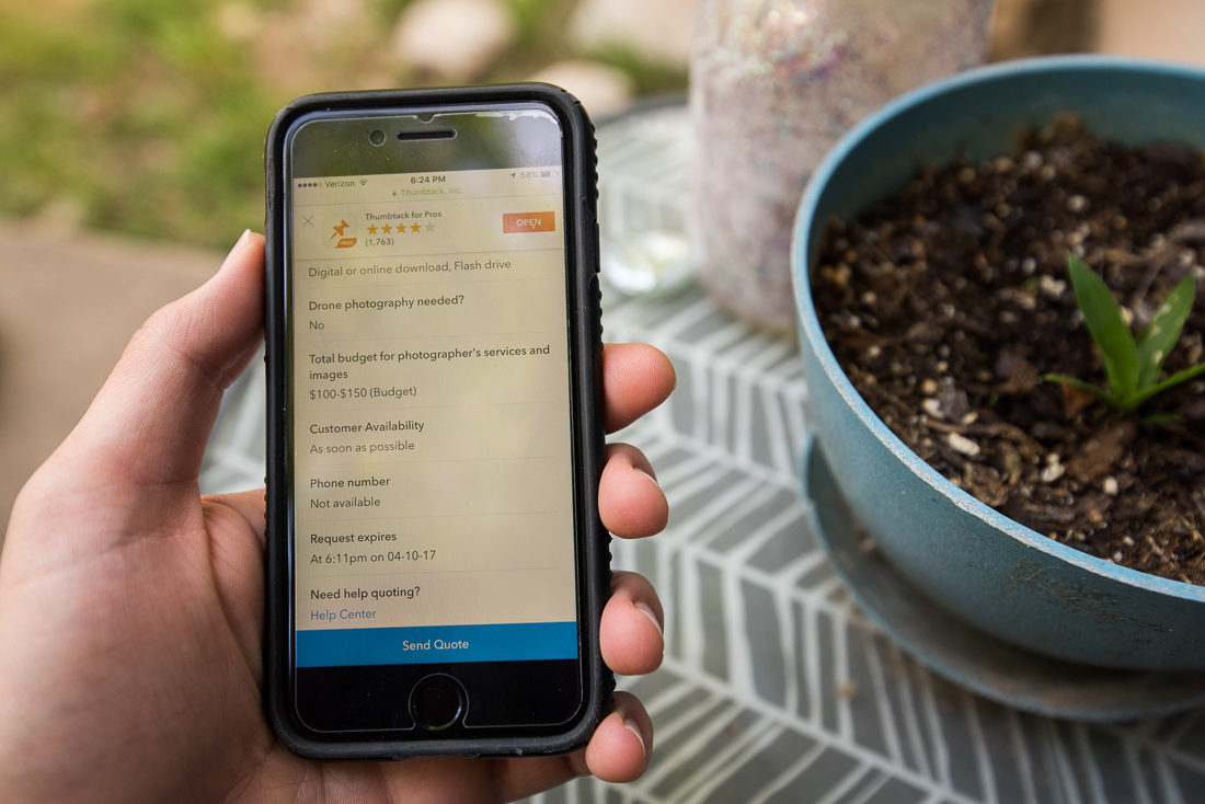 a photo of a hand holding an iphone with a Thumbtack quote displayed on the screen