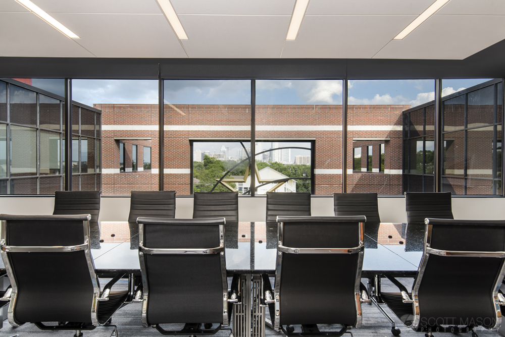 a photo of Aquila Commercia's conference room, looking from behind chairs out the window