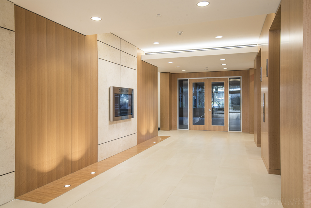 an interior architectural photo of the elevator bank of Mopac Centre in Austin at twilight