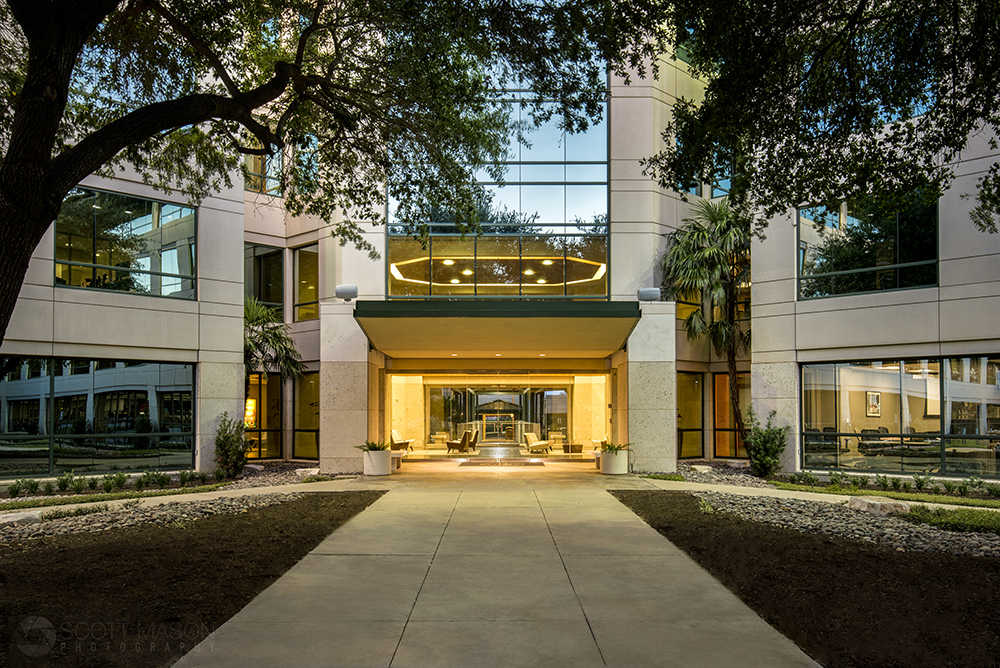 a twilight photo of Barton Skyway's entrance in Austin