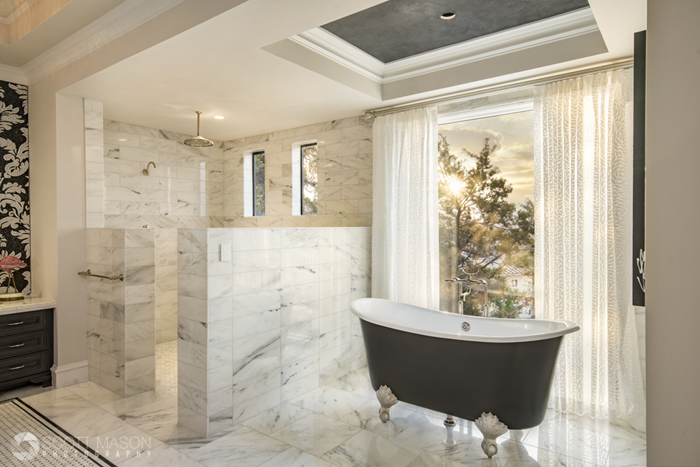 An interior photo showing a bathroom with golden light coming through the windows