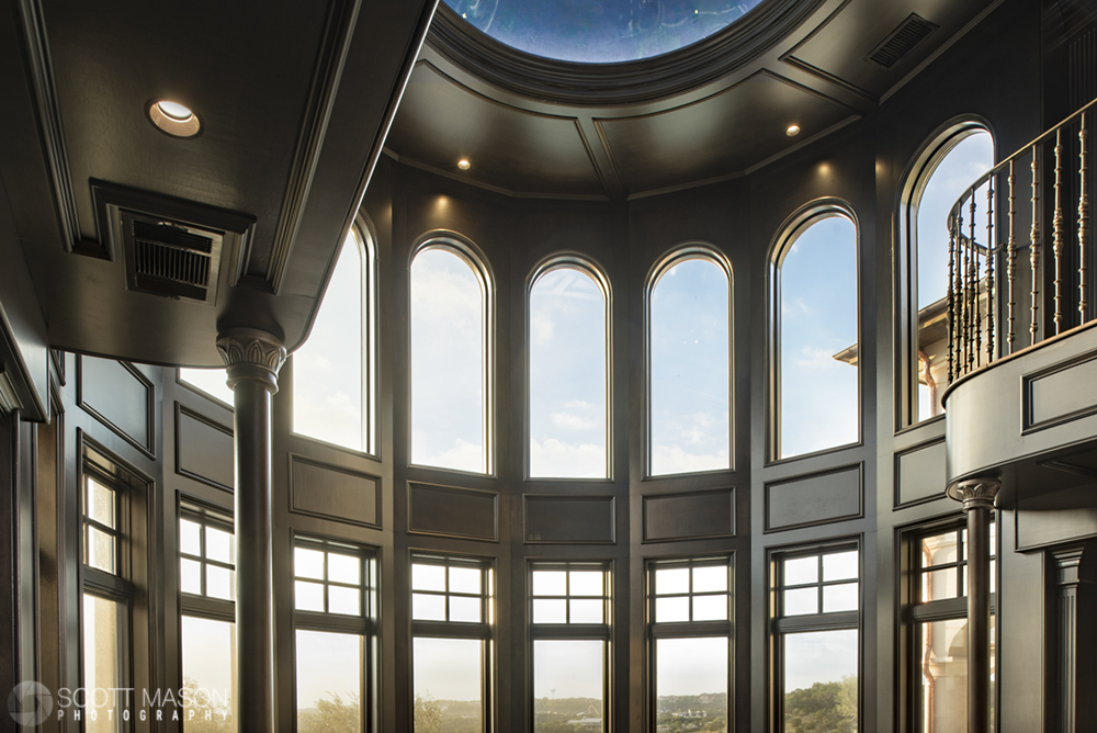 a view of tall bay windows in a home library