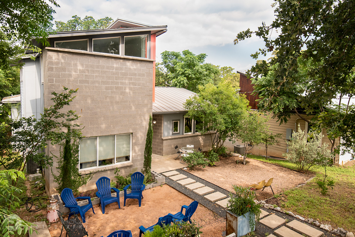 an elevated front exterior photo of a house in east Austin