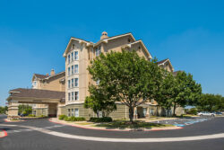 Side exteior of the Hilton Homewood Suites hotel in Austin, Texas