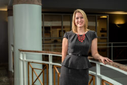 business portrait of a female banker in the hallway of UFCU building