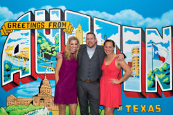 people standing in front of an Austin backdrop
