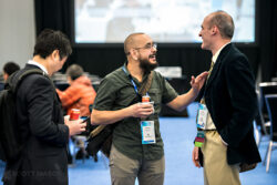 a candid photo of conference attendees chatting