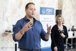 a presenter giving his speech outside of the Austin Convention Center