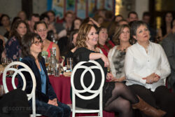 smiling crowd reactions at an awards ceremony